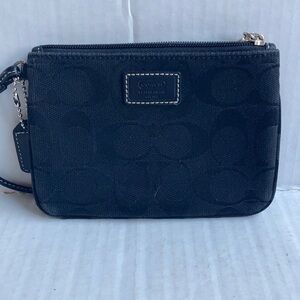 Coach black signature C mini wristlet.